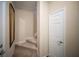 Carpeted staircase, neutral walls, accented by a decorative mirror and a nearby closet at 4235 Overture Cir # 4235, Bradenton, FL 34209