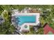 Aerial view showcasing the pool, hot tub, and lush surroundings of the community at 4333 Trails Dr # 10-1, Sarasota, FL 34232