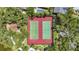 Aerial view showcasing the tennis courts and lush landscaping of the property at 4333 Trails Dr # 10-1, Sarasota, FL 34232
