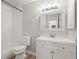 Updated bathroom with white vanity, subway tile in shower and modern lighting at 4333 Trails Dr # 10-1, Sarasota, FL 34232