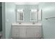 Bathroom featuring a double sink vanity, white cabinets, and neutral paint at 4333 Trails Dr # 10-1, Sarasota, FL 34232