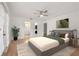 Staged bedroom featuring a ceiling fan and an ensuite bathroom and closet at 4333 Trails Dr # 10-1, Sarasota, FL 34232