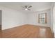 Bright bedroom with ample natural light, hardwood floors, and a ceiling fan at 4333 Trails Dr # 10-1, Sarasota, FL 34232