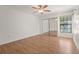 Bedroom featuring a closet with mirrored doors, window, and ceiling fan at 4333 Trails Dr # 10-1, Sarasota, FL 34232