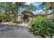 Well-maintained clubhouse featuring a welcoming entrance and lush landscaping at 4333 Trails Dr # 10-1, Sarasota, FL 34232