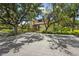 Community clubhouse with mature oak trees for shade and gorgeous landscaping at 4333 Trails Dr # 10-1, Sarasota, FL 34232