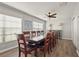 Bright dining room featuring a large table, ceiling fan, and lots of natural light at 4333 Trails Dr # 10-1, Sarasota, FL 34232