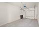 Spacious, empty one-car garage featuring a concrete floor and automatic door opener at 4333 Trails Dr # 10-1, Sarasota, FL 34232