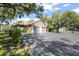 Detached two-car garage providing ample parking space, enhanced by lovely surrounding landscaping at 4333 Trails Dr # 10-1, Sarasota, FL 34232