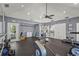Community gym with exercise equipment, a ceiling fan and storage, for residents' use at 4333 Trails Dr # 10-1, Sarasota, FL 34232