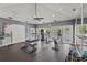 Community gym with weights, machines, mirrored wall, and doors to the pool area at 4333 Trails Dr # 10-1, Sarasota, FL 34232