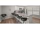 Well-lit kitchen featuring a breakfast bar with seating and stainless steel appliances at 4333 Trails Dr # 10-1, Sarasota, FL 34232