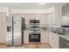 Bright kitchen features stainless steel appliances, granite countertops, and ample cabinet space at 4333 Trails Dr # 10-1, Sarasota, FL 34232