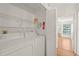 Convenient laundry closet with storage shelves and washer/dryer hookups at 4333 Trails Dr # 10-1, Sarasota, FL 34232