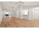 Open concept living and dining room space with hardwood floors and vaulted ceilings at 4333 Trails Dr # 10-1, Sarasota, FL 34232