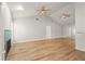 Spacious living room with hardwood floors, fireplace, vaulted ceilings and ample natural light at 4333 Trails Dr # 10-1, Sarasota, FL 34232