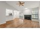 Open concept living room featuring hardwood floors and bar seating at 4333 Trails Dr # 10-1, Sarasota, FL 34232