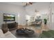 Open concept living room with hardwood floors, vaulted ceilings and modern decor at 4333 Trails Dr # 10-1, Sarasota, FL 34232