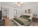 Bedroom featuring a bed, artwork, and an open doorway to the bathroom at 4333 Trails Dr # 10-1, Sarasota, FL 34232