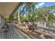 Outdoor patio with tables and chairs, creating a social gathering space next to the pool at 4333 Trails Dr # 10-1, Sarasota, FL 34232