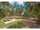 Community playground featuring a swing set, picnic table, and slide, providing a fun recreational space for residents at 4333 Trails Dr # 10-1, Sarasota, FL 34232