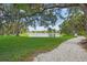 Scenic community walking path along a lake, offering a serene outdoor space for residents to enjoy nature at 4333 Trails Dr # 10-1, Sarasota, FL 34232