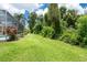 Well-manicured backyard with green lawn and lush landscaping at 4374 Mirabella Cir, Bradenton, FL 34210