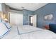 Bedroom with closet, blue walls, and ensuite bathroom at 4374 Mirabella Cir, Bradenton, FL 34210
