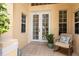Cozy entrance with tiled flooring, a comfortable chair, and natural light streaming through the windows at 4374 Mirabella Cir, Bradenton, FL 34210