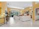 Bright and airy living room with high ceilings, tile floors, and a fireplace at 4374 Mirabella Cir, Bradenton, FL 34210