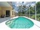 Enclosed pool with clear blue water and a white concrete deck, with seating nearby at 4374 Mirabella Cir, Bradenton, FL 34210