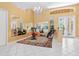 Dedicated workout area with exercise bike, mirrored walls, natural light, and tile floors at 4374 Mirabella Cir, Bradenton, FL 34210