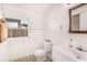 Bathroom features a toilet, vanity, and medicine cabinet with a tiled floor at 5028 Oxford N Ave, St Petersburg, FL 33710