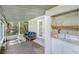 View of laundry area with washer and dryer located inside of the enclosed sunroom at 5028 Oxford N Ave, St Petersburg, FL 33710