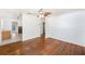 Bright living room with hardwood floors, ceiling fan, and neutral walls at 5028 Oxford N Ave, St Petersburg, FL 33710