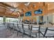 Bar and lounge area with large screen TVs, high top seating and vaulted ceiling at 5364 Salcano St, Sarasota, FL 34238