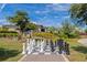 Outdoor community space featuring a giant chess board for residents' enjoyment, with landscaping and community house in the background at 5364 Salcano St, Sarasota, FL 34238