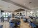 Large community kitchen and entertaining area with lots of tables and seating at 5364 Salcano St, Sarasota, FL 34238