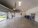 Spacious three car garage with epoxy floors, storage shelves and lots of room for vehicles at 5364 Salcano St, Sarasota, FL 34238