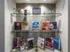 Information center on glass shelves with community flyers and information for residents at 5364 Salcano St, Sarasota, FL 34238