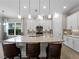 Stylish kitchen featuring a large center island, pendant lighting, and stainless steel appliances at 5364 Salcano St, Sarasota, FL 34238