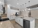 Well-equipped kitchen with stainless steel appliances, granite countertops, and a center island with seating at 5364 Salcano St, Sarasota, FL 34238