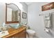 Bathroom featuring a vessel sink on a wood vanity and decorative accents at 5417 Champagne # 63, Sarasota, FL 34235