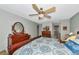 Bright bedroom featuring a ceiling fan and dresser, offering a comfortable and classic space at 5417 Champagne # 63, Sarasota, FL 34235