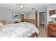Bedroom with a four-poster bed, with a closet and adjoining door to the bathroom at 5417 Champagne # 63, Sarasota, FL 34235