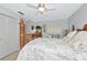 Cozy bedroom featuring a bright window, a four poster bed and a closet at 5417 Champagne # 63, Sarasota, FL 34235