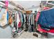Walk-in closet featuring a rack full of clothing, shoes, and accessories at 5417 Champagne # 63, Sarasota, FL 34235