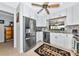 Bright kitchen features stainless steel appliances, ample cabinet space, and mosaic tile backsplash at 5417 Champagne # 63, Sarasota, FL 34235
