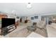 Spacious living room with neutral decor, comfortable seating, and ample natural light at 5417 Champagne # 63, Sarasota, FL 34235