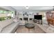 Bright living room with neutral tones, fireplace, and built-in display cabinets; ideal for relaxation at 5417 Champagne # 63, Sarasota, FL 34235